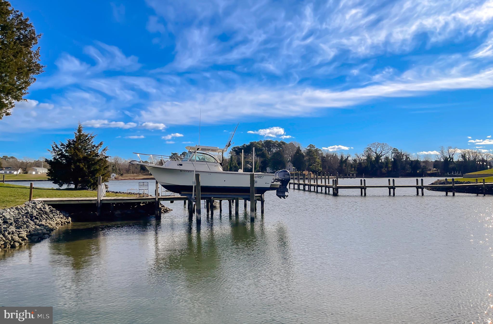 610 Rolling Hills Road Solomons, MD 20629 - Photo 7 of 33 a view of a lake with sitting area