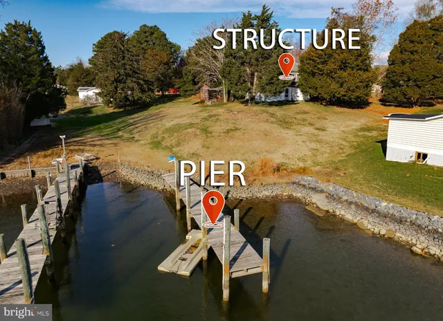 a view of swimming pool with a yard and sitting area