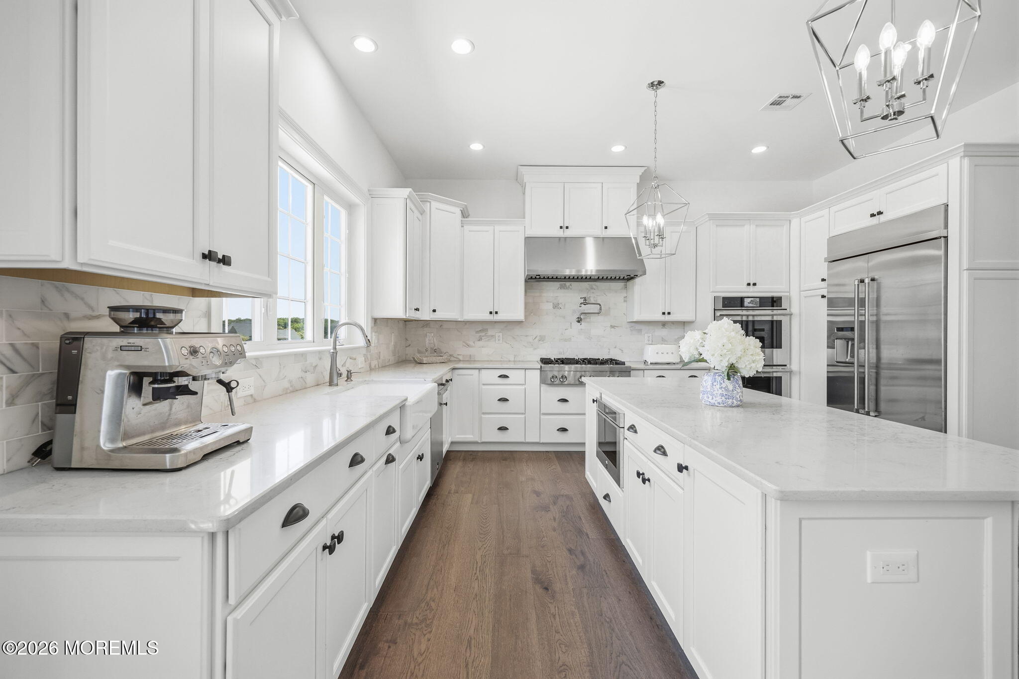 66 Windermere Road Lincroft, NJ 07738 - Photo 10 of 48 a large kitchen with stainless steel appliances granite countertop a lot of counter space and wooden floors