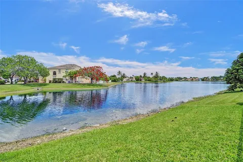 a view of a lake with houses in the background