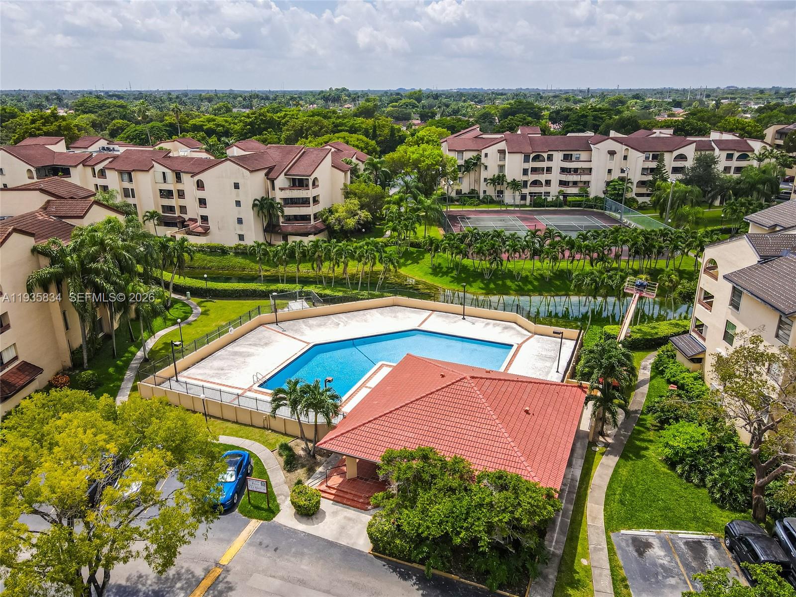 9255 Southwest 125th Avenue, Unit R308 Miami, FL 33186 - Photo 17 of 19 an aerial view of residential houses with outdoor space and trees all around