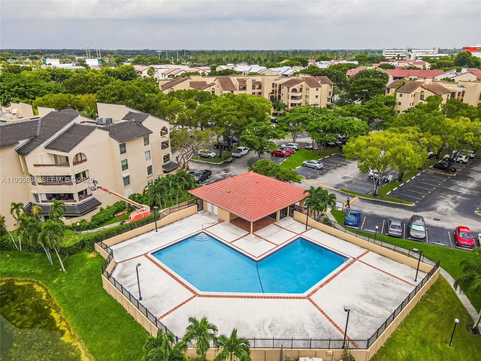 9255 Southwest 125th Avenue, Unit R308 Miami, FL 33186 - Photo 18 of 19 an aerial view of multiple houses with a yard