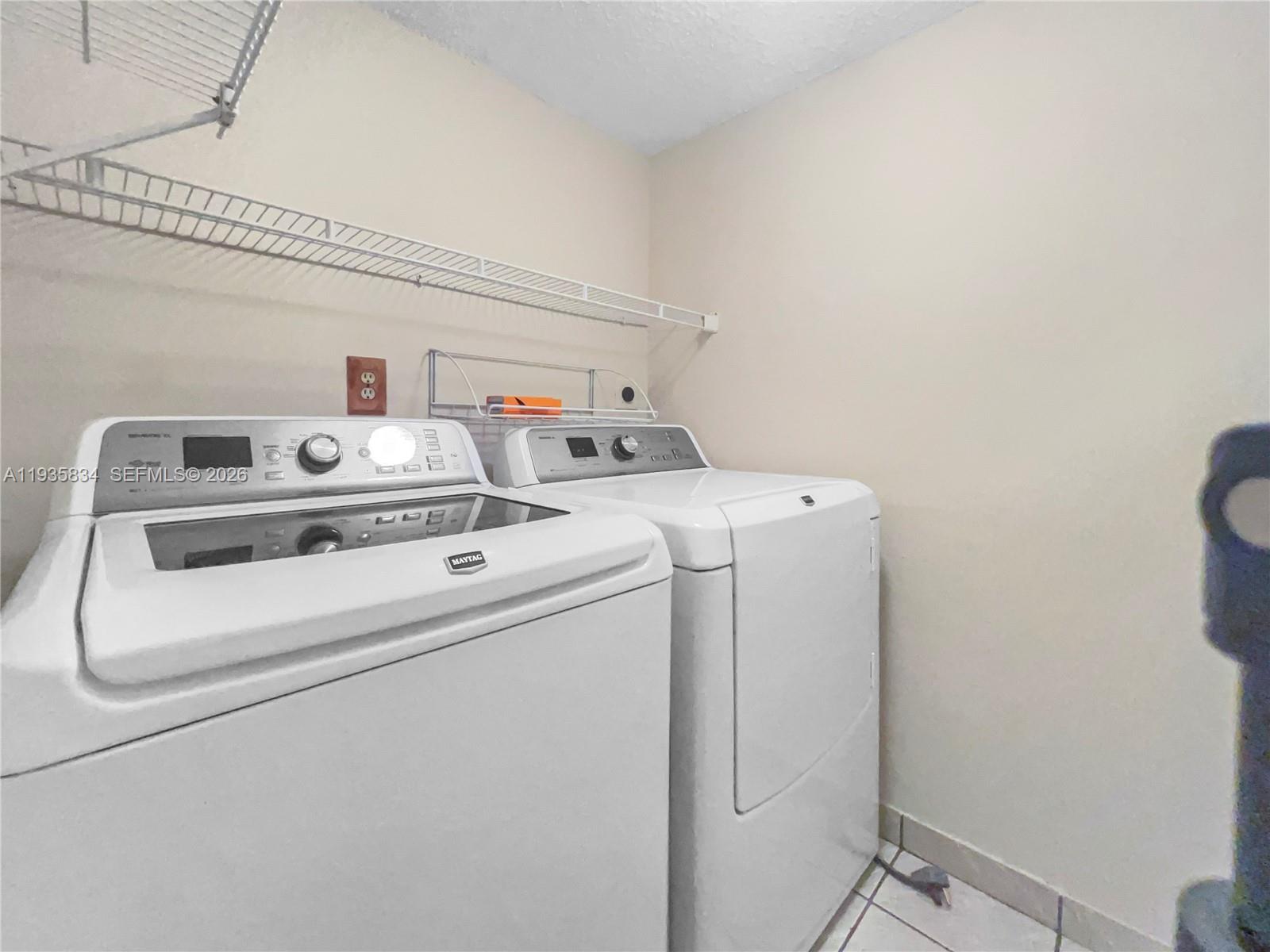 9255 Southwest 125th Avenue, Unit R308 Miami, FL 33186 - Photo 9 of 19 a utility room with dryer and washer