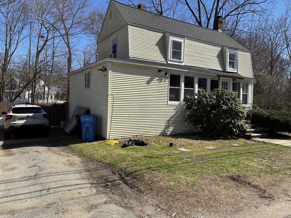 129 Commercial Street Whitman, MA 02382 - Photo 2 of 10 a view of a house with a yard