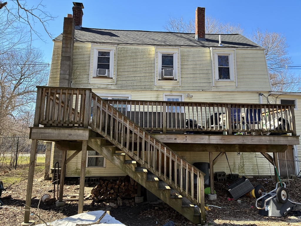 129 Commercial Street Whitman, MA 02382 - Photo 3 of 10 a view of a house with wooden deck