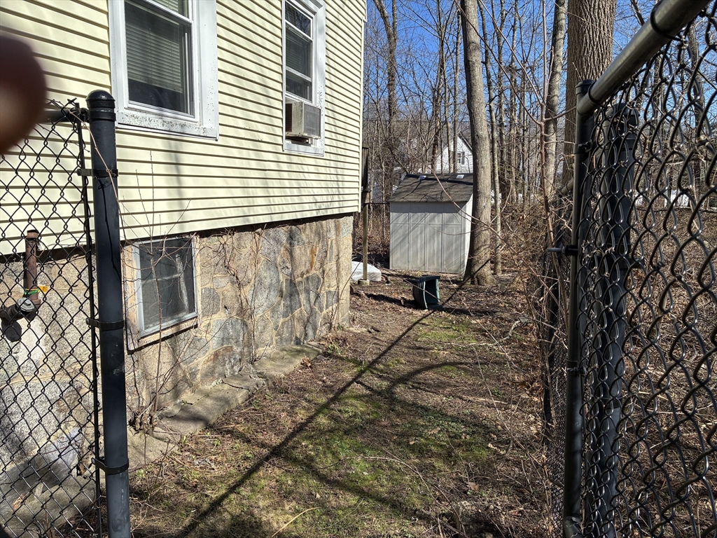 129 Commercial Street Whitman, MA 02382 - Photo 4 of 10 a view of a house with a yard