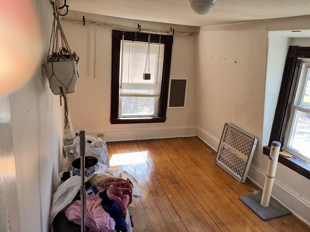 129 Commercial Street Whitman, MA 02382 - Photo 9 of 10 a view of room with window and wooden floor