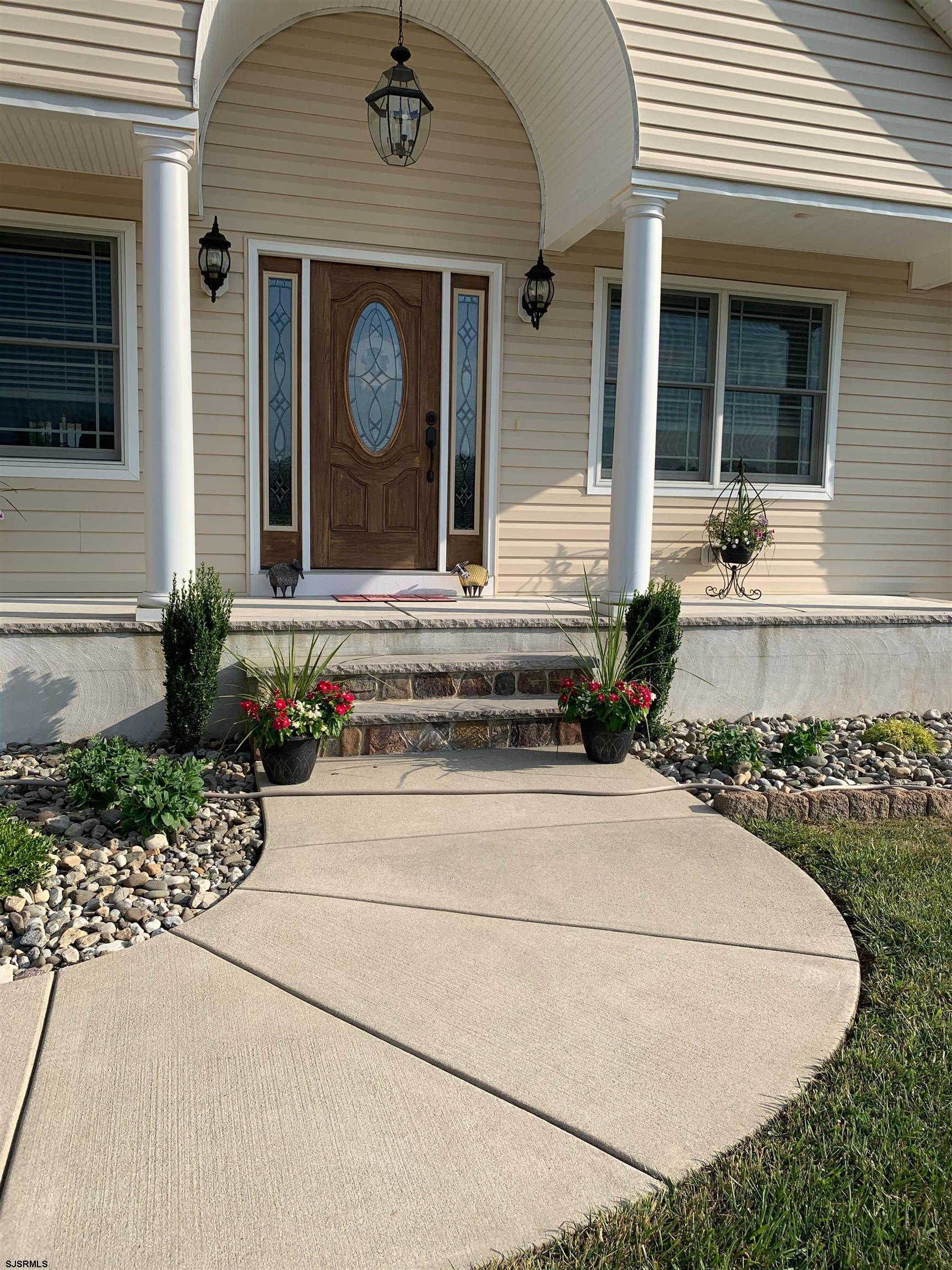 215 Lebanon Road Bridgeton, NJ 08302 - Photo 3 of 50 a front view of a house with garden