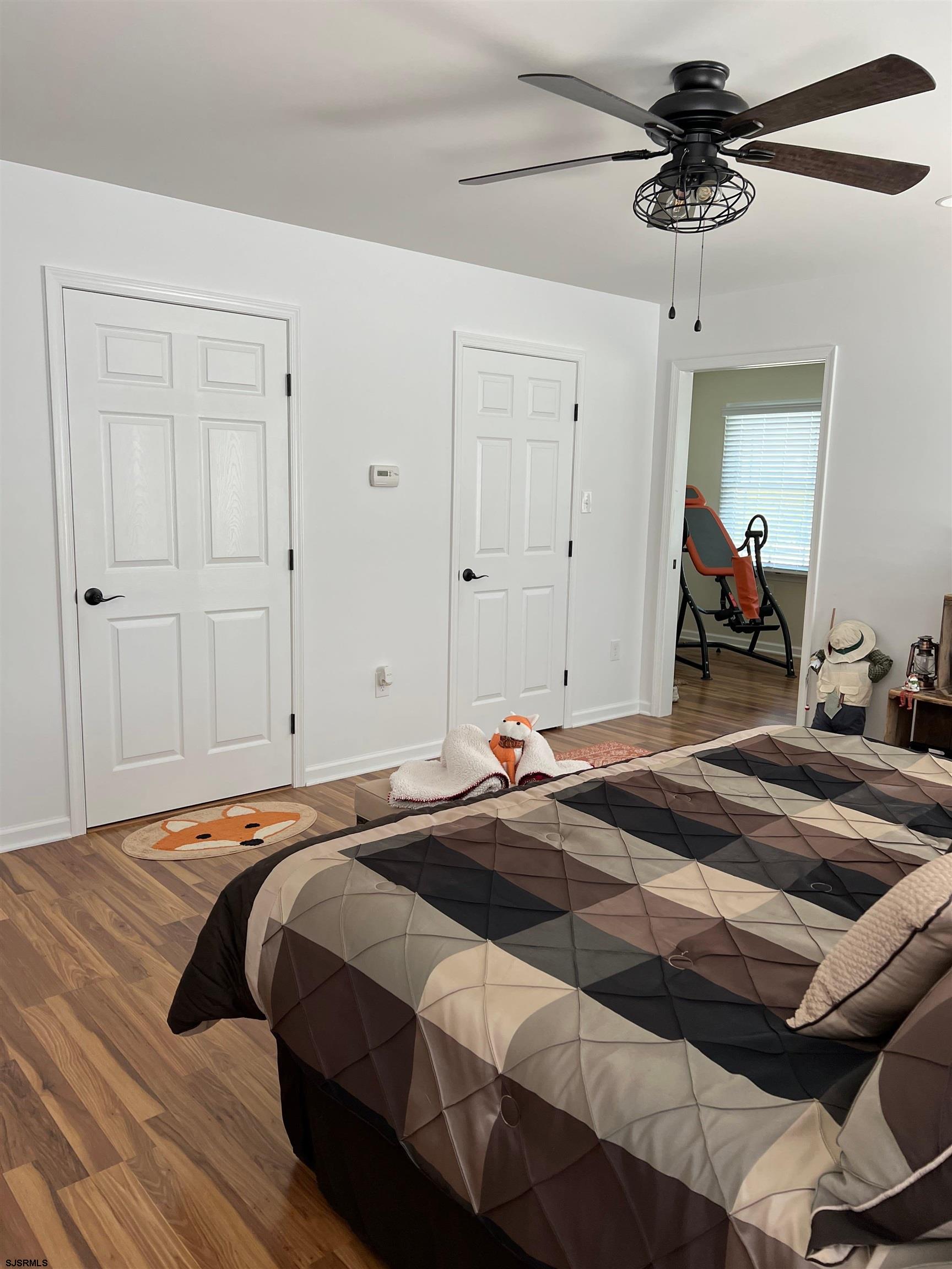 215 Lebanon Road Bridgeton, NJ 08302 - Photo 32 of 50 a bedroom with a bed and a chandelier