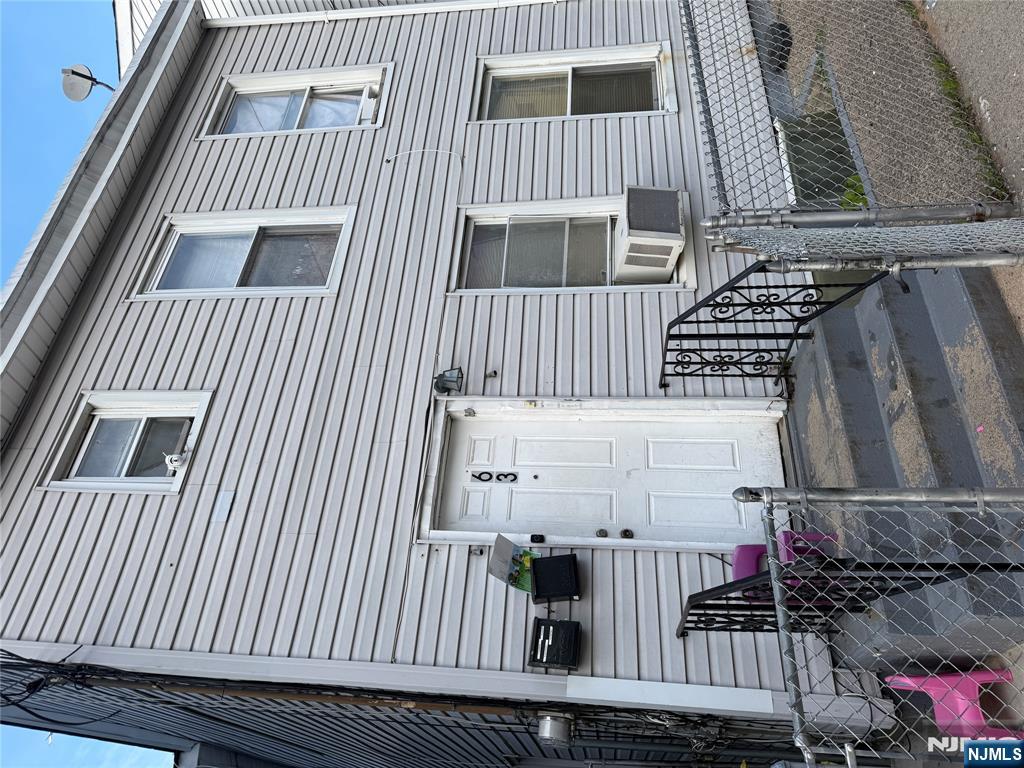63 Pearl Street Paterson, NJ 07501 - Photo 2 of 16 a view of a house with two chairs