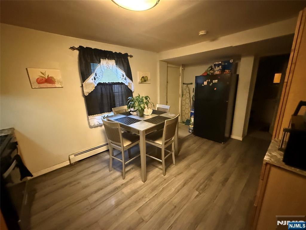 63 Pearl Street Paterson, NJ 07501 - Photo 4 of 16 a dining room with furniture and wooden floor