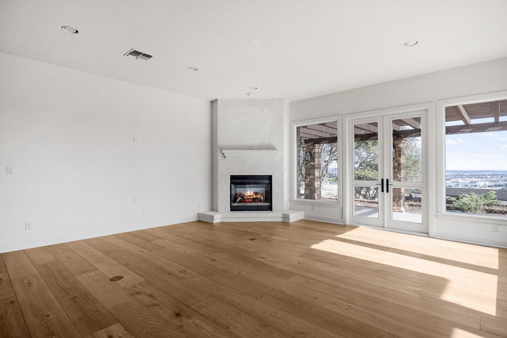 3613 Ranch View Court Kerrville, TX 78028 - Photo 14 of 41 a view of an empty room with wooden floor and a window