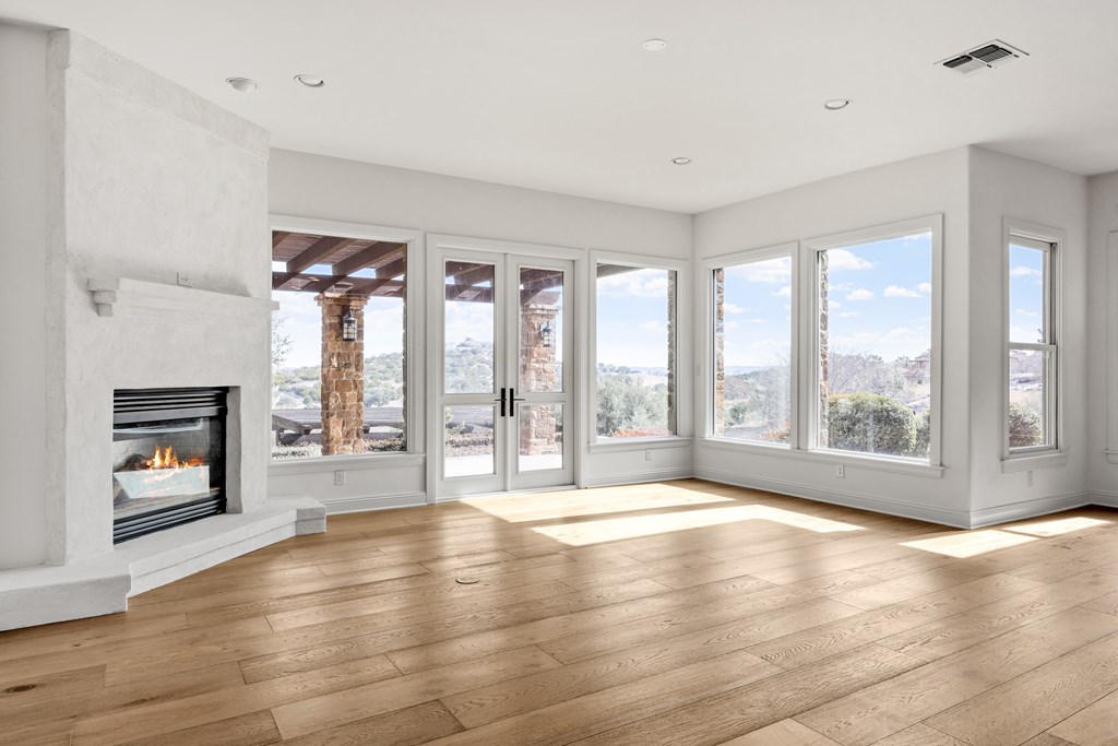 3613 Ranch View Court Kerrville, TX 78028 - Photo 15 of 41 a view of an empty room with a window and a fireplace