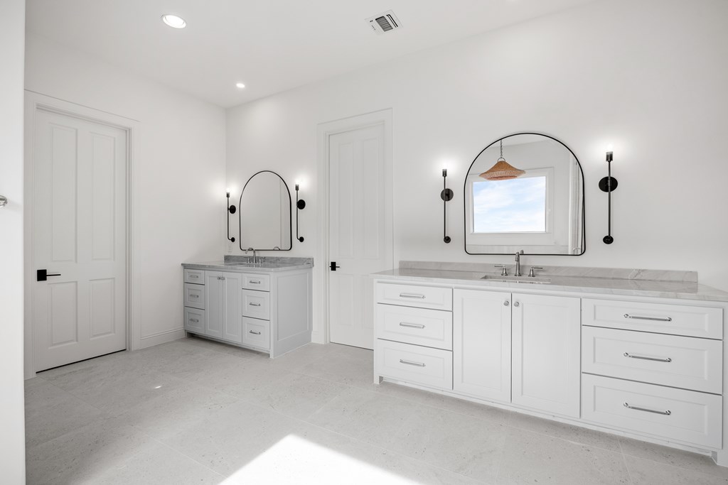 3613 Ranch View Court Kerrville, TX 78028 - Photo 18 of 41 a spacious bathroom with a double vanity sink and a mirror