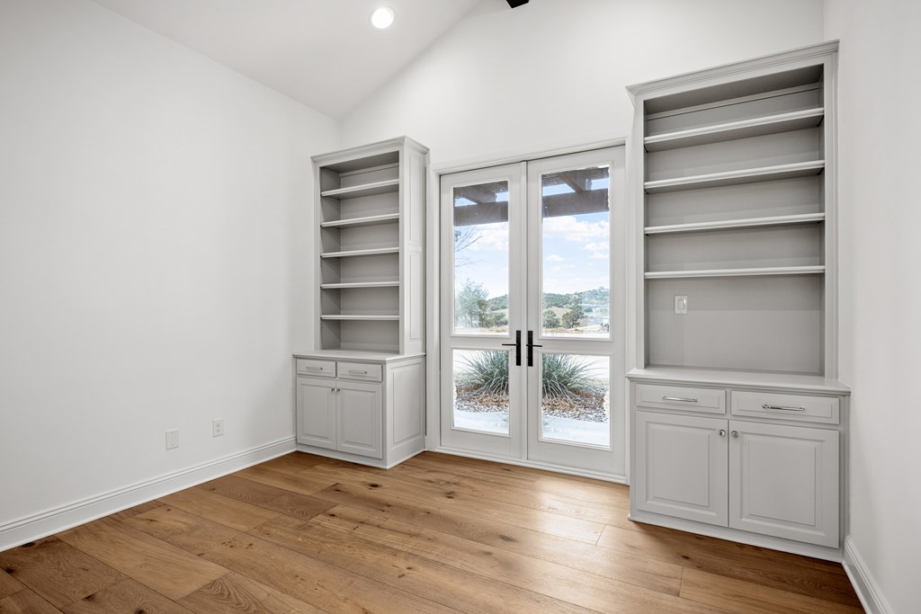 3613 Ranch View Court Kerrville, TX 78028 - Photo 21 of 41 a view of an empty room with a window and wooden floor