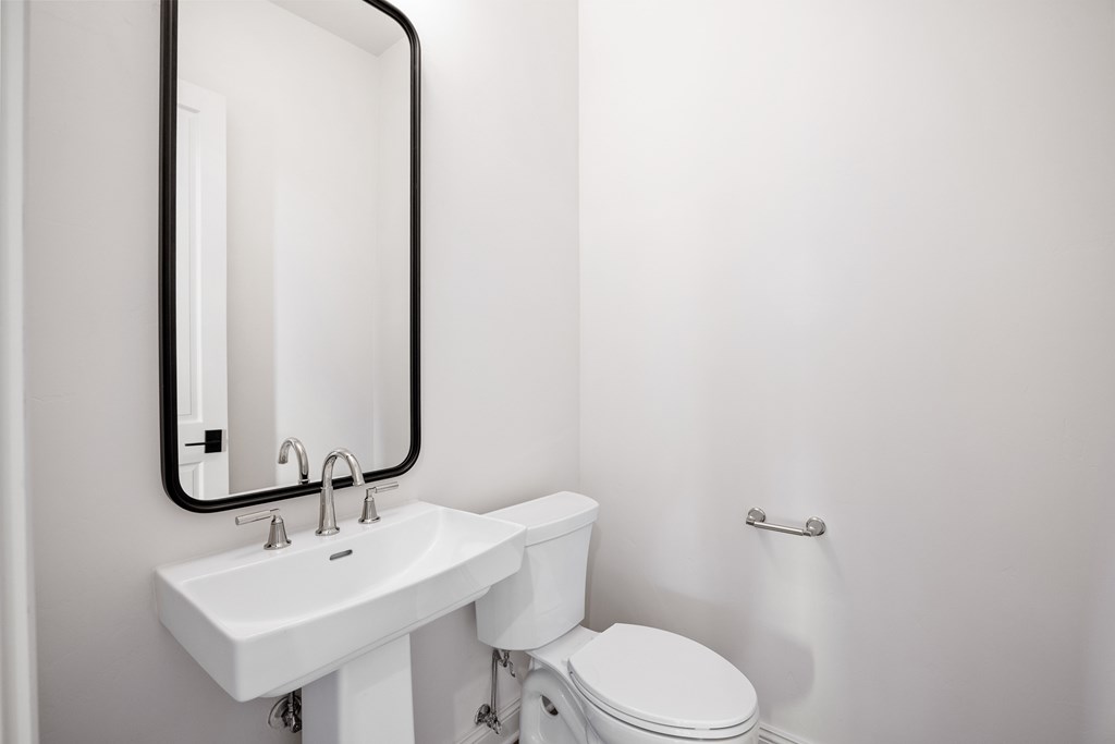 3613 Ranch View Court Kerrville, TX 78028 - Photo 22 of 41 a bathroom with a toilet a sink and mirror