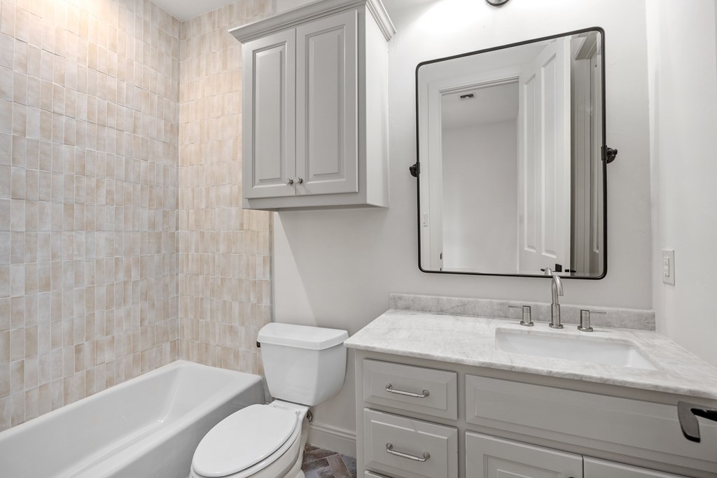 3613 Ranch View Court Kerrville, TX 78028 - Photo 24 of 41 a bathroom with a granite countertop sink toilet and shower