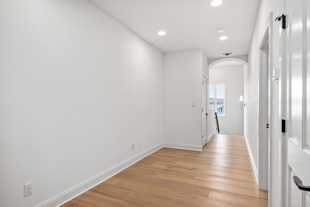 3613 Ranch View Court Kerrville, TX 78028 - Photo 26 of 41 a view of a hallway with wooden floor