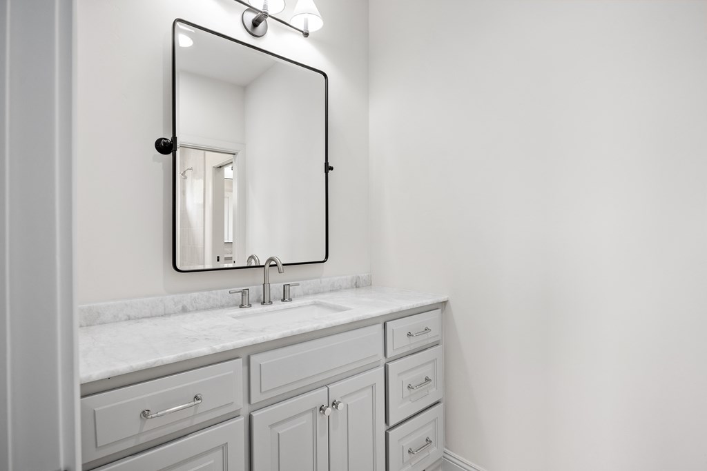 3613 Ranch View Court Kerrville, TX 78028 - Photo 28 of 41 a bathroom with a sink and a mirror