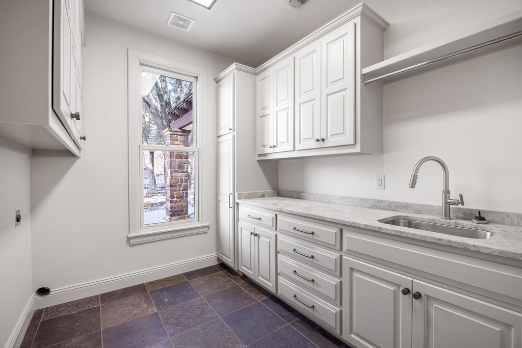 3613 Ranch View Court Kerrville, TX 78028 - Photo 33 of 41 a kitchen with stainless steel appliances granite countertop a sink and a window