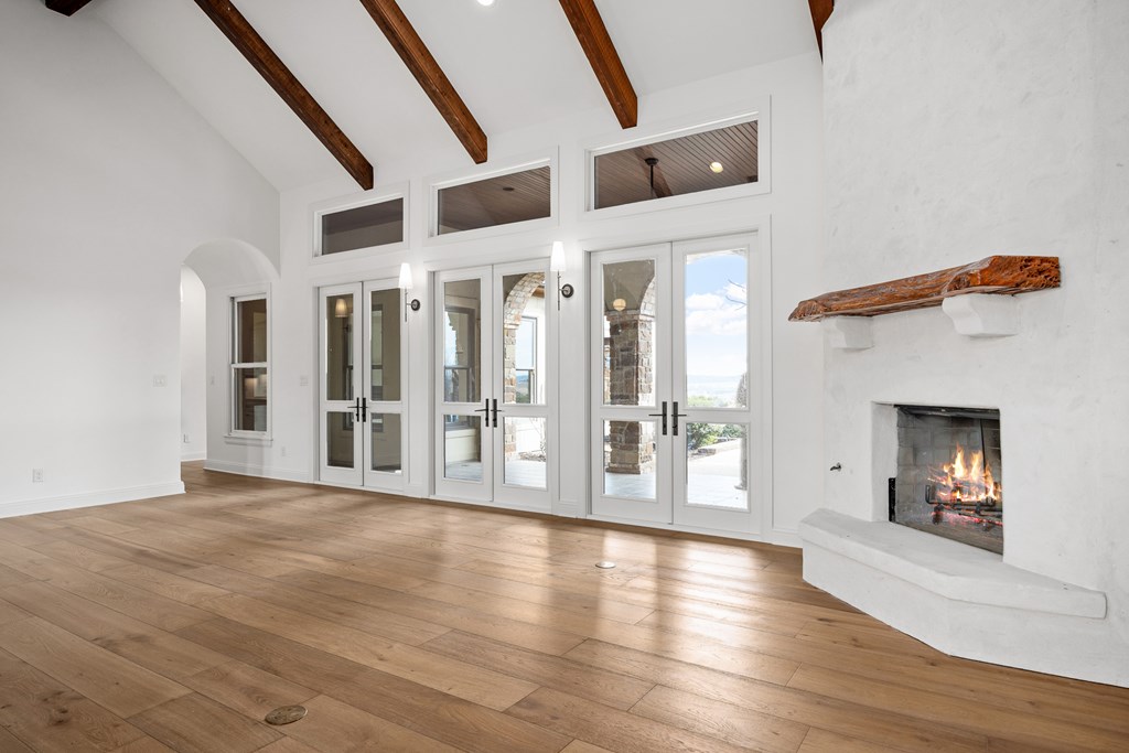 3613 Ranch View Court Kerrville, TX 78028 - Photo 6 of 41 a view of a room with wooden floor and fireplace