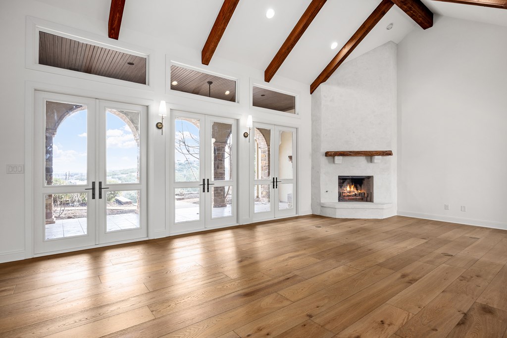 3613 Ranch View Court Kerrville, TX 78028 - Photo 7 of 41 a view of an empty room with a fireplace and a window