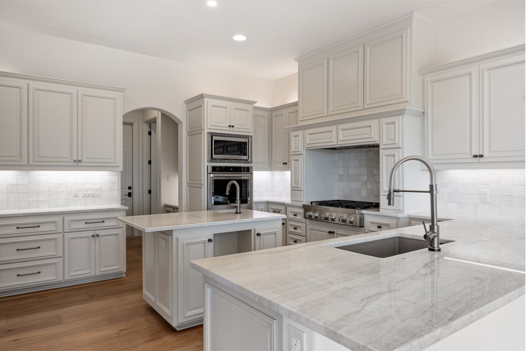 3613 Ranch View Court Kerrville, TX 78028 - Photo 9 of 41 a kitchen with appliances a sink and cabinets