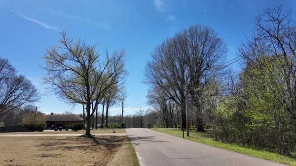 a view of road with trees