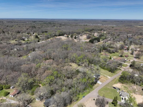 an aerial view of house with yard