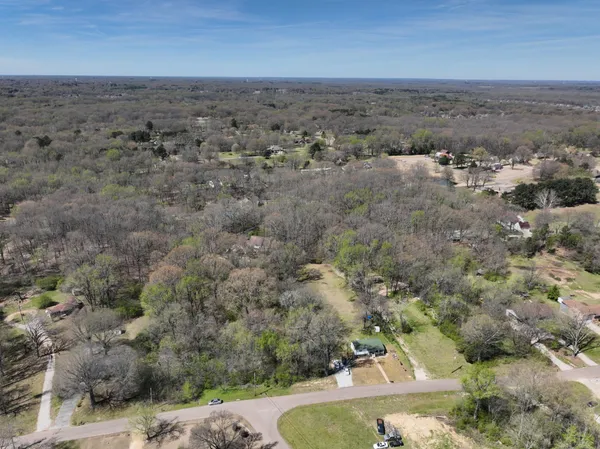 an aerial view of house with beach