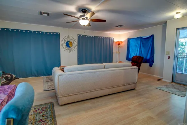 a room with a bed and a chandelier