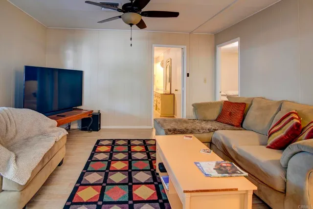 a bedroom with furniture and a rug