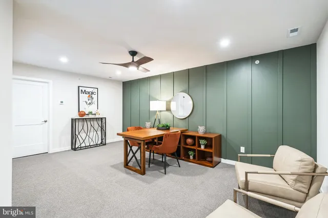 a living room with furniture a window and a table