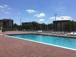 4158 Inverrary Drive, Unit 404 Lauderhill, FL 33319 - Photo 11 of 15 a swimming pool with outdoor seating and yard