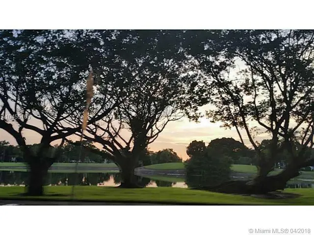 a swimming pool with outdoor seating and yard