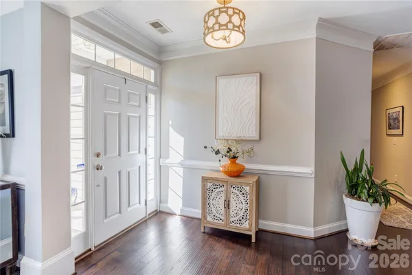 a view of entryway with wooden floor