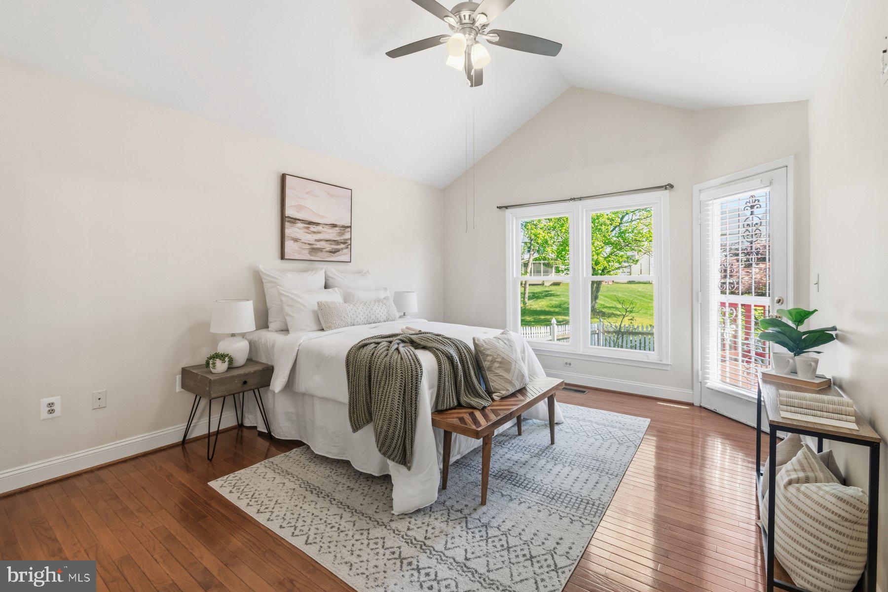 14215 Greenview Drive Laurel, MD 20708 - Photo 18 of 35 a bedroom with a bed and wooden floor