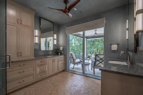 a view of a living room and a window with wooden floor