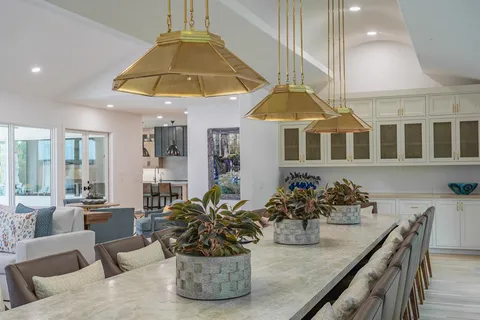 a living room with fireplace furniture and a large window