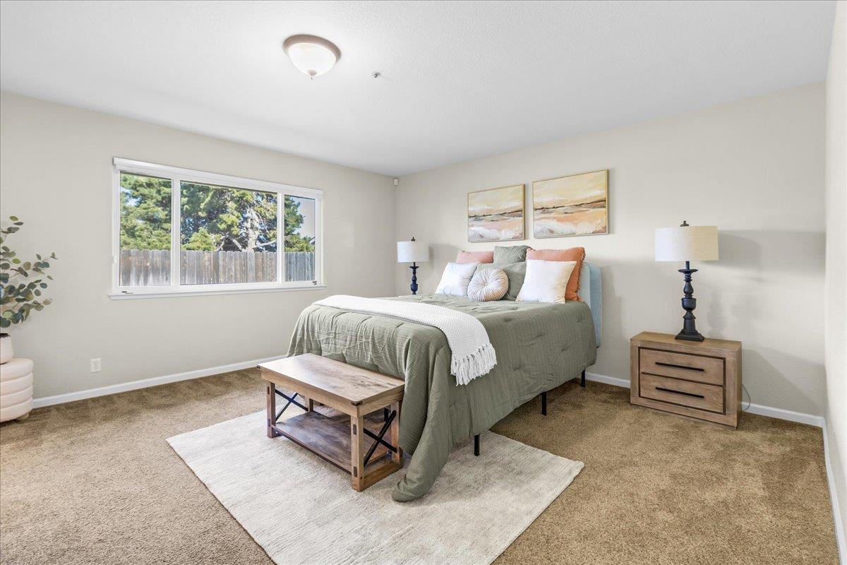 18595 Ranchito Del Rio Drive Salinas, CA 93908 - Photo 17 of 40 a bedroom with a bed lamps and window