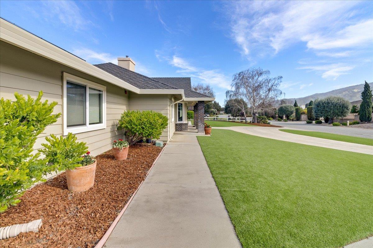 18595 Ranchito Del Rio Drive Salinas, CA 93908 - Photo 30 of 40 a front view of a house with a yard and potted plants