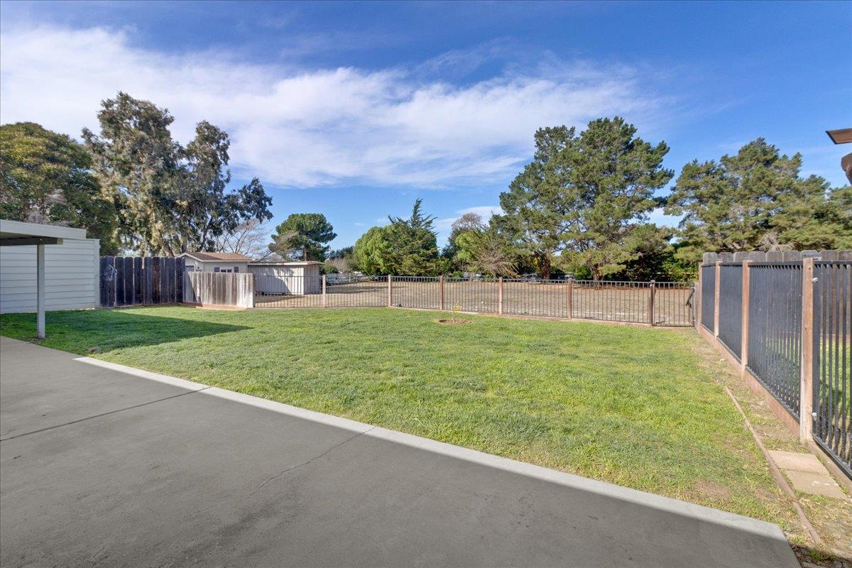 18595 Ranchito Del Rio Drive Salinas, CA 93908 - Photo 32 of 40 a view of a yard with a house in the background