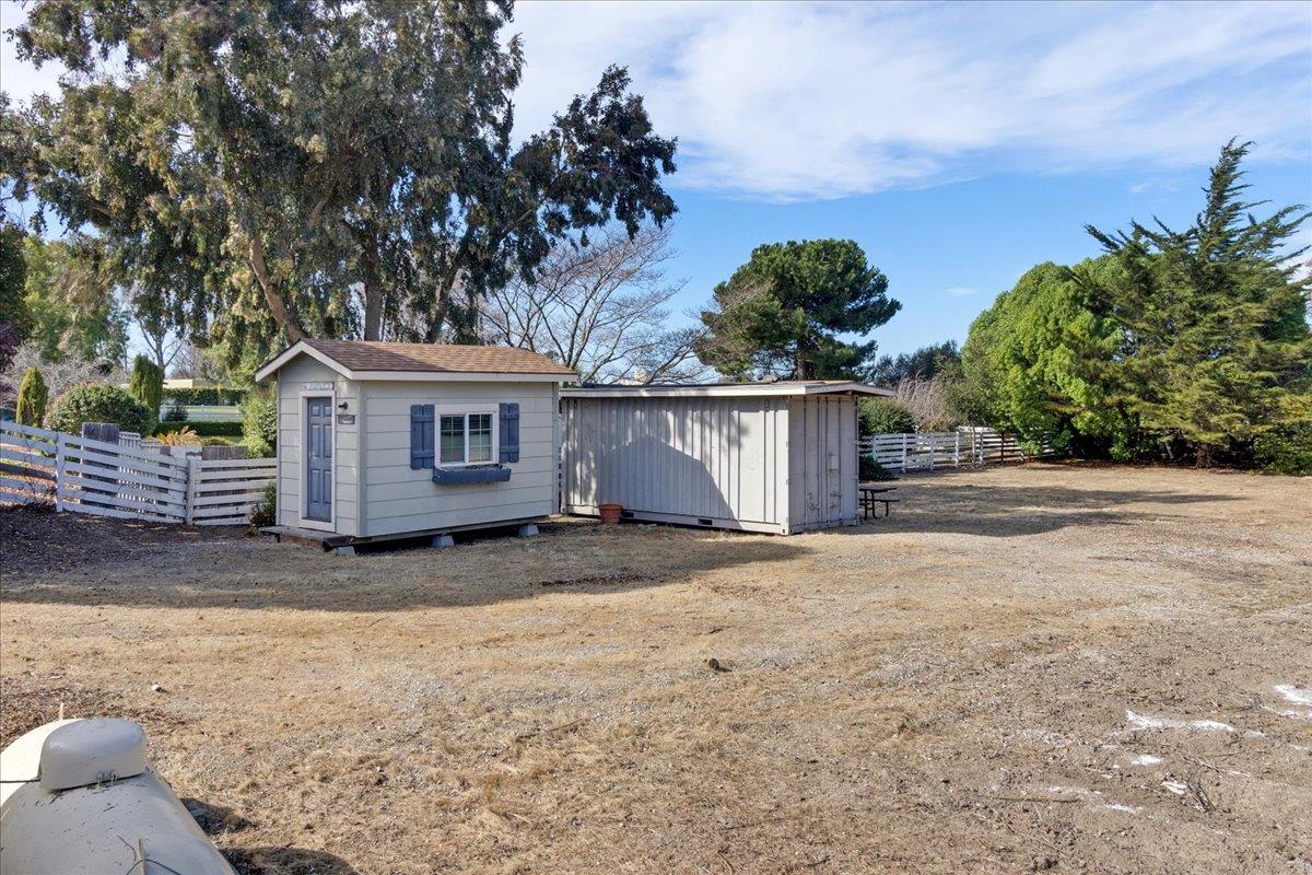 18595 Ranchito Del Rio Drive Salinas, CA 93908 - Photo 35 of 40 a view of a house with a yard and garage