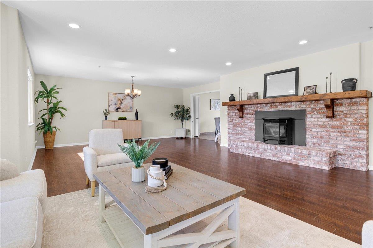 18595 Ranchito Del Rio Drive Salinas, CA 93908 - Photo 9 of 40 a living room with furniture fireplace and dining room