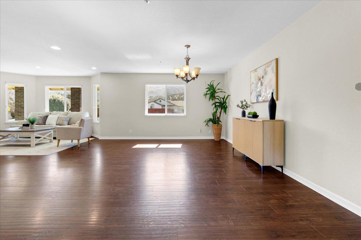 18595 Ranchito Del Rio Drive Salinas, CA 93908 - Photo 10 of 40 a view of an empty room with wooden floor and a window