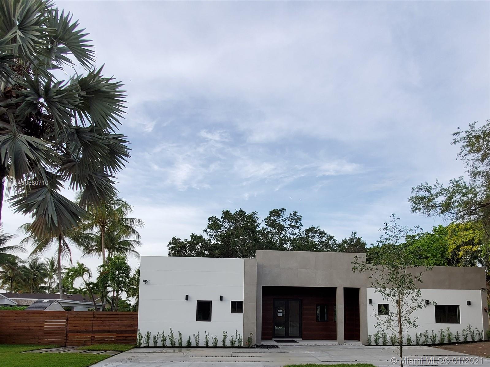 a view of house with palm tree in front of it