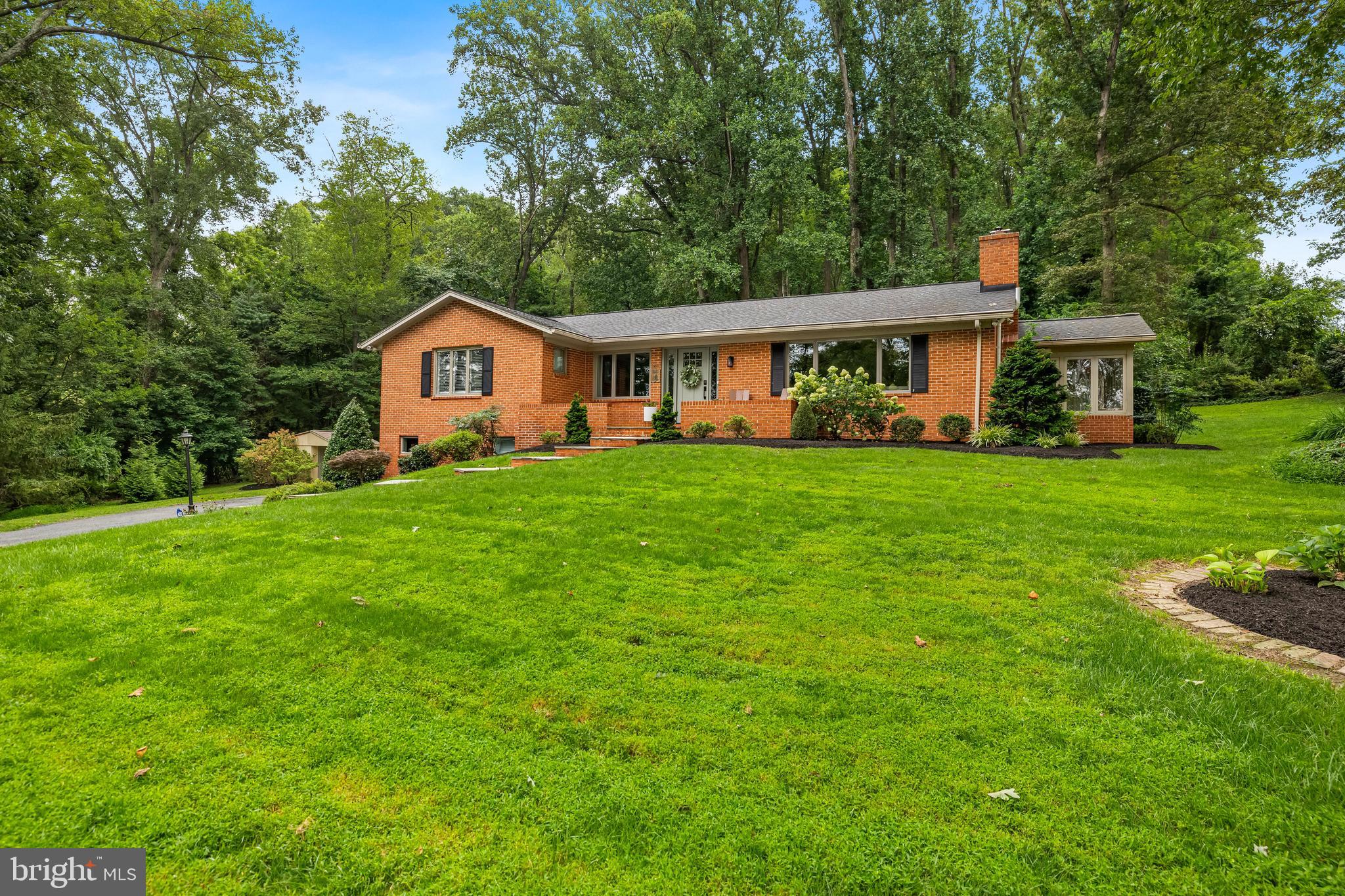 5507 Williams Road Hydes, MD 21082 - Photo 1 of 39 a front view of a house with a garden