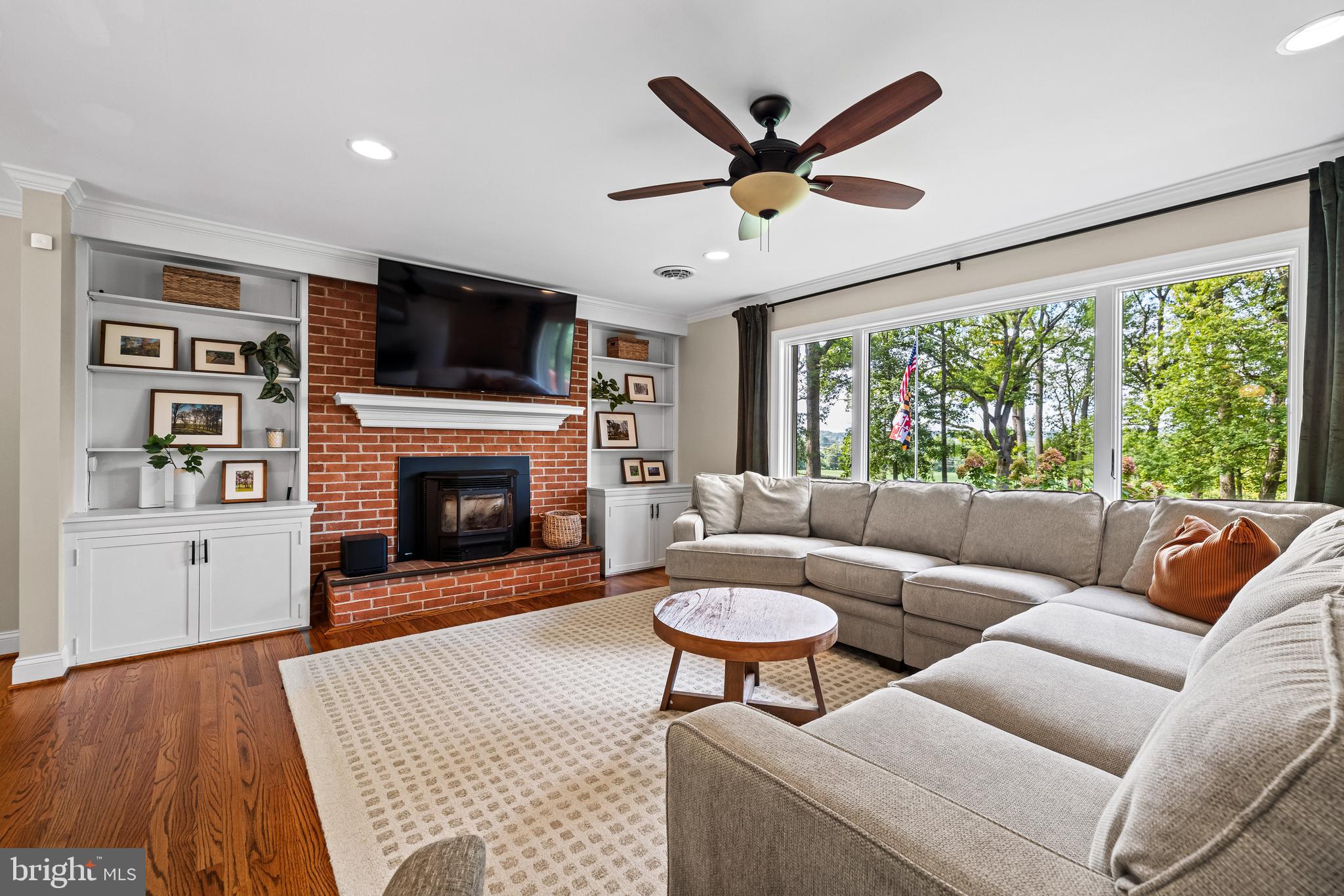 5507 Williams Road Hydes, MD 21082 - Photo 10 of 39 a living room with furniture a flat screen tv and a fireplace