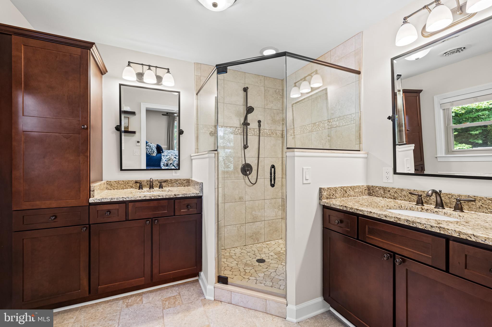 5507 Williams Road Hydes, MD 21082 - Photo 18 of 39 a bathroom with a shower sink and mirror