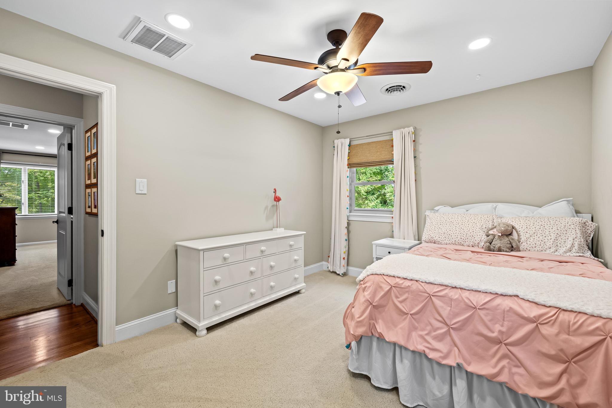 5507 Williams Road Hydes, MD 21082 - Photo 25 of 39 a bedroom with a bed and a chandelier